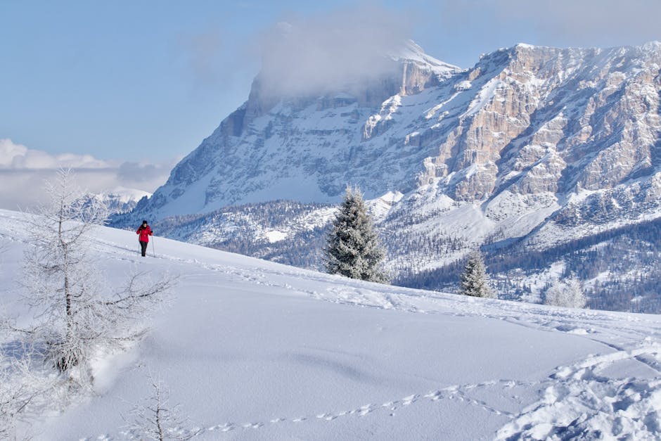 Breathtaking alpine ski resort with snow-covered peaks, pristine slopes, and charming chalets nestled in a winter wonderland